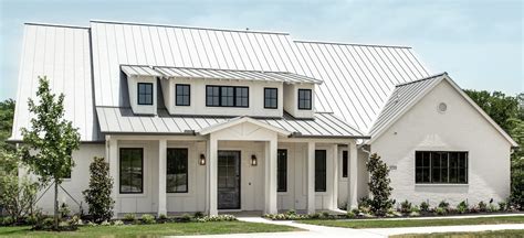 white painted brick house with metal roof|painted brick metal roof house.